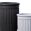 Decorative Ornament Set Featuring Black And White Fluted Vases With Pedestal Bases