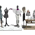 Mannequins in Clothing Display with Clothing Racks Table Books and Rug