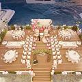 Waterfront Wedding Setup With Flower Arch Wooden Walkway And Yachts At Sunset