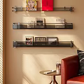 Wall mounted Bookshelf With Metal Brackets And Decorative Books Artworks In Modern Living Room Sunlight