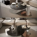 Elegant Black Glass Coffee Table With Cylindrical Legs And Decorative Glassware