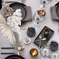 Elegant Tableware Set with Black Plates Gold Cutlery Wine Glasses And Linen Napkins
