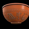 Orange Ceramic Bowl With Ancient Figural Carvings And Decorative Patterns As Household Item