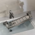 Modern Kitchen Faucet And Metal Dish Rack In Sink With Dripping Water