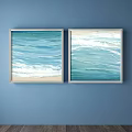 Two Blue Wave Landscape Paintings With Sand And White Frames On Blue Wall 3d model