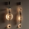 Modern Illuminated Wall Lamps With Circular Glass Shades And Metal Frame Design
