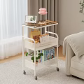 Warm Living Room With White Rolling Cart Tablet Desserts Pink Lamp Books And Green Plant