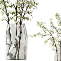 Decorative Transparent Vase Holding White Small Flowers And Green Leafy Branches