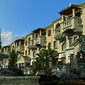 Elegant Garden Landscape With European Building Balconies Fountain Palm Trees And Lush Greenery
