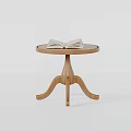 Wooden Side Table with Round Top and Three Legs Featuring Open Book on Surface 3d model