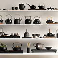 Black Tea Ware Collection with Various Teapots Cups and Wooden Handles on White Shelves