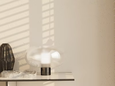 Contemporary Table Lamp With Transparent Glass Shade On Desk Near Decorative Sculpture And Stone 3d model