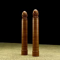 Two Brown Wooden Capitals With Detailed Lotus Carved Patterns On Black Background