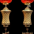 Three Red Chinese Lanterns With Golden Ornate Bodies And Red Tassels