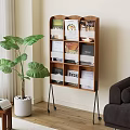 Wooden Bookshelf With Books And Magazines In Living Room With Green Plant And Sofa