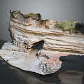 Layered Rock Formation Featuring Natural Arch And Green Vegetation On Textured Surface
