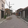 Urban Narrow Street With Buildings Roller Shutters Trash Bins Street Lamps Overhead Power Lines