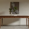 Wooden Desk With Three Drawers Green Plant White Vase Books And Abstract Painting Above