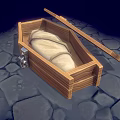 Wooden Box With White Wrapped Object And Wooden Stick On Stone Pavement