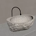 Natural Stone Oval Sink With Textured Surface And Metallic Faucet