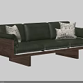 Stylish Green Leather Sectional Sofa With Wooden Frame And Patterned Pillows