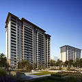 Modern High Rise Residential Building With Green Landscape And Clear Blue Sky