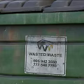 Outdoor Public Green Trash Bin With Wheels Lid And Warning Labels