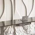 Modern Reception Desk Set With Black Countertop Rock Base Laptop And White Wavy Textured Wall