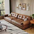 Cozy Living Room Interior With Brown Leather Sofa Framed Paintings And Round Coffee Table