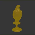 Golden Eagle Statue Beautifully Displayed on Shiny Pedestal Against Black Background