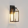Modern Black Frame Wall Light With Clear Glass And Illuminated Bulb