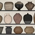 Handcrafted Ceramic Vessels Displayed On Shelves With Various Shapes And Natural Textures