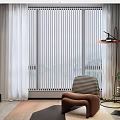 Modern Accent Chair in Brown with Floor Lamp Green Plants and Geometric Rug by Window