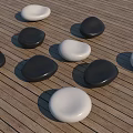 Black And White Pebble Shaped Landscape Seats On Wooden Deck