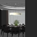 Modern Restaurant Dining Space With Round Table Black Chairs Flower Centerpiece Chandelier And Window View