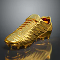 Luxurious Golden Soccer Cleat Featuring Intricate Laces Studded Design And Reflective Metallic Surface