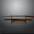 Traditional Japanese Katana Weapon with Red Scabbard and Gold Accents on Wooden Stand