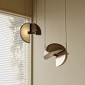 Modern Semicircular Wall Lights with Metallic Shades and Natural Light Through Window Blinds