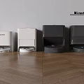 Smart Robot Vacuum Cleaners In Multiple Colors Placed On Wooden Floor Against Wall