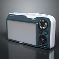 Canon IXUS Digital Camera Featuring Large Display Screen Control Buttons And Blue White Design
