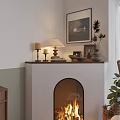 Cozy Fireplace With Burning Fire Mantel Candles Lamp Framed Art And Green Plants