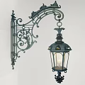 Vintage Ornate Metal Wall Lamp With Transparent Glass Shade And Curved Design