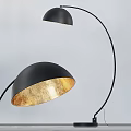 Modern Black Shade Floor Lamp With Golden Interior And Curved Pole Design