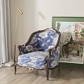 Elegant Blue and White Floral Armchair with Wooden Armrests beside Green Painting and Floor Lamp