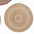 Woven Round Rugs in Neutral and Multi Colored Hues Stacked for Stylish Home Decor