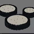 Three Circular Decorative Objects With Textured Black Edges And White Centers 3d model