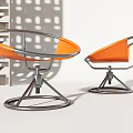 Two Orange Modern Leisure Chairs With Metal Frame And Circular Base Design