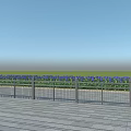 Modern Metal Fence on Wooden Deck with Green Grass and Blue Flowers