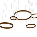 Golden Circular Chandelier with Multiple Hanging Rings in Modern Interior Space
