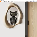 Irregular Shaped Beige Frame Mirror Reflecting Black Doll With X Eyes In Modern Interior